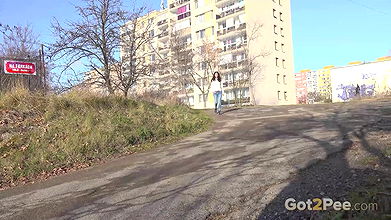 Ali Bordeaux pees on a road in the suburbs