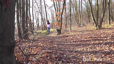 Ali Bordeaux pees on leaves in the woods