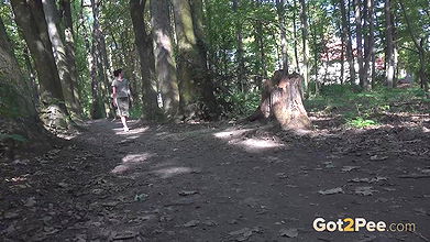 Ali Bordeaux relieves herself in the woodland
