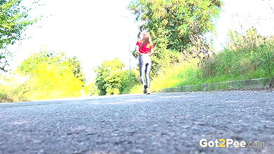 Barbe stands and shows off her ass while peeing