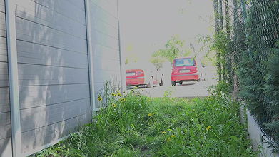Blonde and brunette piss by the side of a building