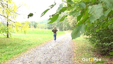 Blonde babe Chrissy relieves herself on a path