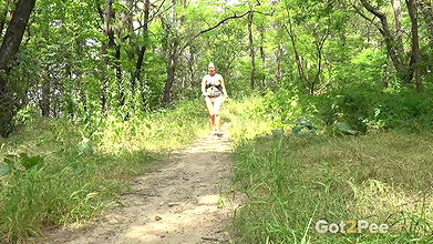 Blonde babe Licky Lex squats to pee in the woods