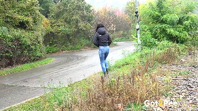 Ali B squats and pees near the train tracks