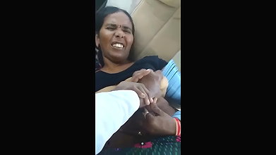 playing with mature boobs inside car