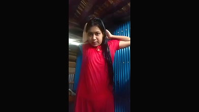 cute slum girl recording her own dress change