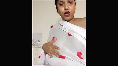 Aunty showing her boobs in transparent white saree