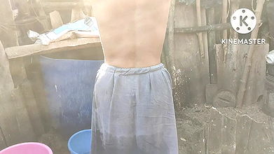 Anita Yadav bathing outside