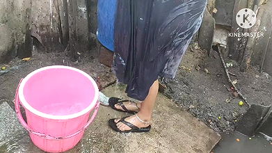 Mature likes to pour water on herself with clothes on