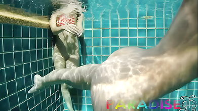 Underwater public pool threesome with two cock hungry sluts