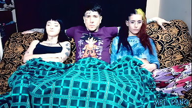 Punk dude with lots of tattoos is having a threesome with two skinny teens