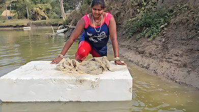 Mouni Fishing in Village pond floating on a Thermo