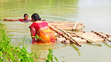 Traditional net fishing by village women   Village