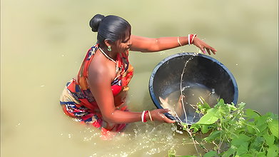 Traditional village women bare hand fishing   Amaz