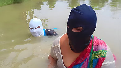 Village Masked Women Fishing in Dangerous Water