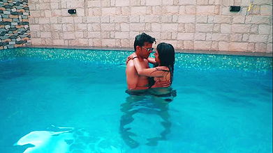 stepbrother enjoyed with his stepsister in the swimming pool