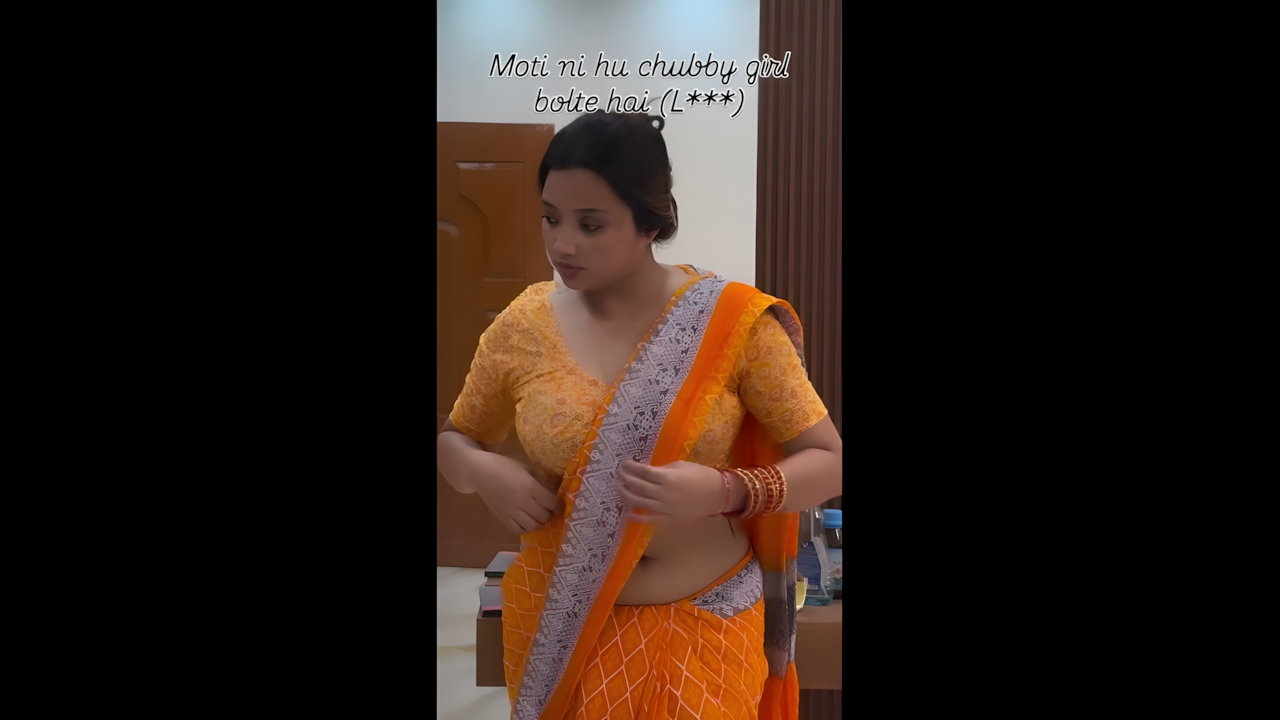 lady big deep navel in orange saree 22