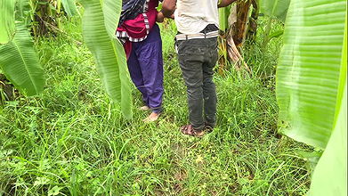 I took my neighbor into the banana plantation and hugged her and started fucking