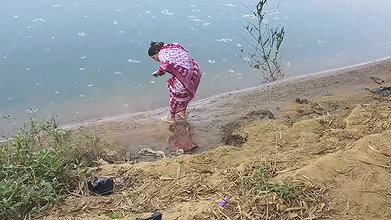 Indian village wife bathing in the river in outdoor area