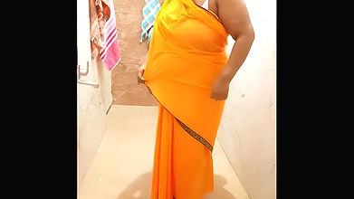 Indian maid bathing in saree