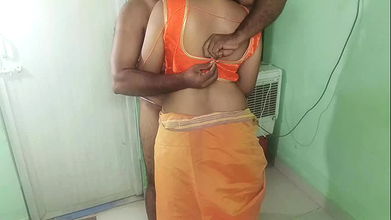 married glamour women orange saree standing position romance