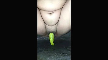 Desi girl trying cucumber into her right pussy