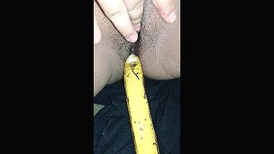 Indian girl playing with banana
