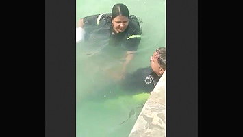 Giving handjob in swimming pool
