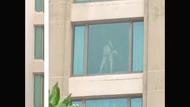 Couple fucking in hotel, captured by peoples from outside