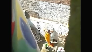 indian wife open air shower filmed