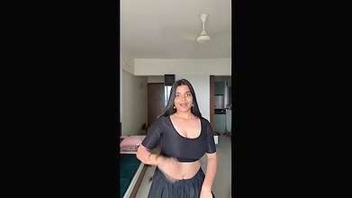 busty desi girl jiggling her big breast in black dress
