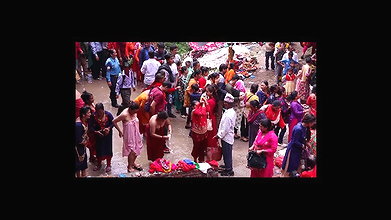 Multiple women wearing clothes after bath at ghat
