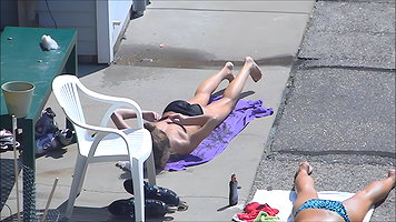 Tanned and attractive desi49 babe nude bitch lying on beach